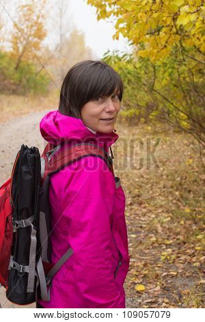 Hiker Woman With Backpack Relaxing In The Autumn Forest