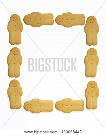 Ginger man cakes Christmas background on white wall