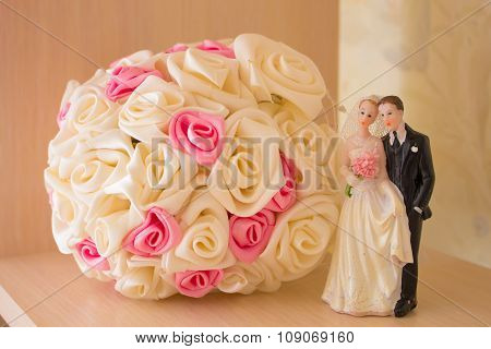 Wedding bouquet and figurine