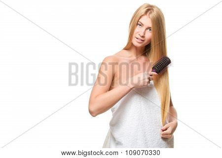 Young attractive blond woman with blue eyes in a towel