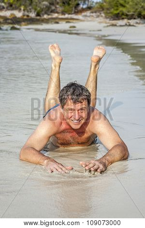 Man Lies At The Beach