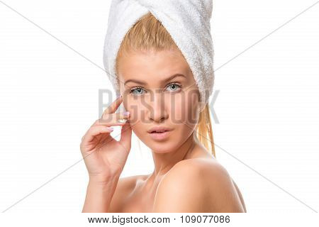 Young attractive blond woman with blue eyes in a towel