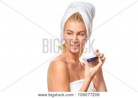 Beautiful spa girl holding jar of cream isolated on white