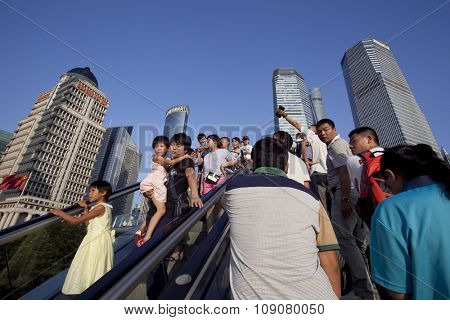 SHANGHAI, CHINA, 25 JULY, 2015:Visitors in Shanghai. Tourists in the Shanghai Lujiazui financial and Trade Zone at 25 July, 2015