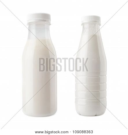 plastic bottles of milk drink close-up isolated