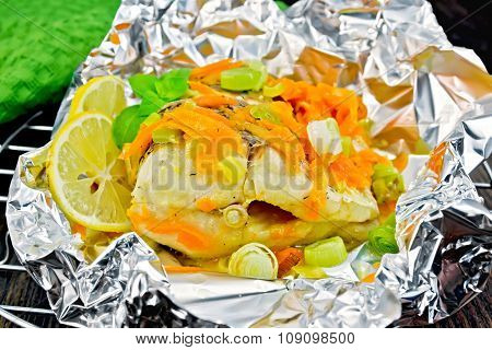Pike With Carrots And Leeks In Foil On Board