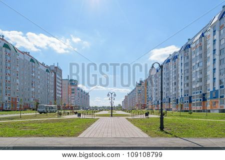 Spacious Pedestrian Walkway With Lanterns In New District Of City