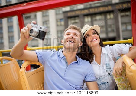 Young couple with rerto camera