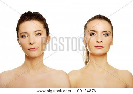 Two attractive topless sisters with make up.