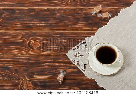 Tea Cup and Plate Of Fine Bone China. Sweets. Burnt Wooden Backg