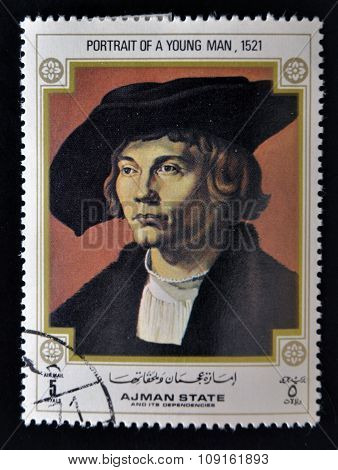 AJMAN - CIRCA 1970: A stamp printed in Ajman shows Portrait of Young Man by Albrecht Durer