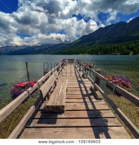 Amazing sunny day at Champferersee lake in the Swiss Alps. Silvaplana village, Switzerland, Europe.