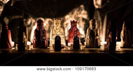 Lewis chess set replica lit by candlelight