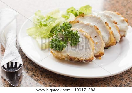 Sliced Chicken Cordon Bleu With Creamy Sauce And Romane Leaf Salad