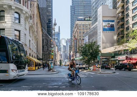 Girl Rides A Bike On The Street In New York