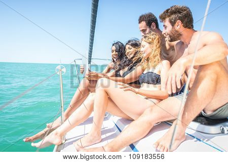 Group Of Friends Watching Tablet On A Boat