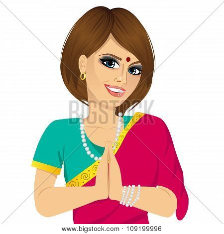 Traditional Indian woman holding hands in prayer position