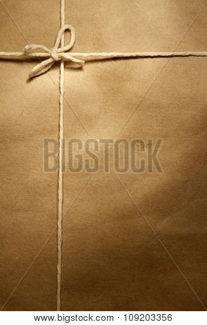 Tied knot on brown parcel