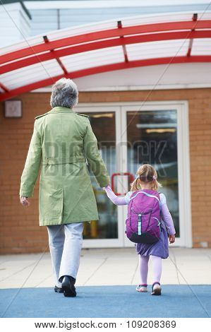 Grandmother Taking Granddaughter To School