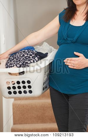 Pregnant Woman Doing Chores At Home