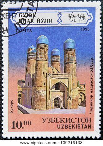 A stamp printed in Uzbekistan shows Tchar-Minor Madrasa Bukhara XIX century circa 1995