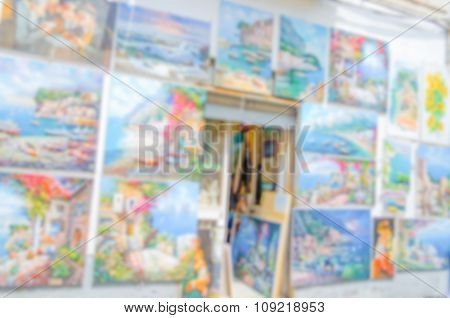 Defocused Background With A Wall Full Of Paintings
