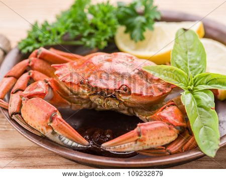Seafood dish - cooked crab with lemon and herbs.