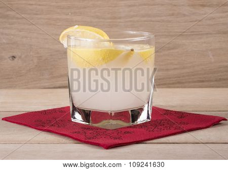 Image Of Glass Of Lemonade On Wood Background With Nepkin.