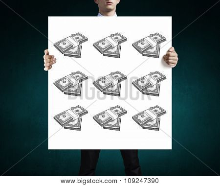 Businessman holding banner with drawn money earning concept