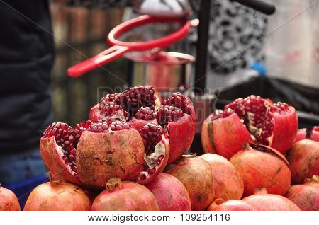 Stack pomegranates on juice vendor's cart in Istanbul.