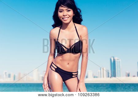 Sexy tourist girl in Dubai city beach
