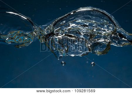 Air bubbles underwater isolated on nlue background splashing