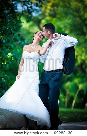 Wedding couple in love injoying together in nature and smiling