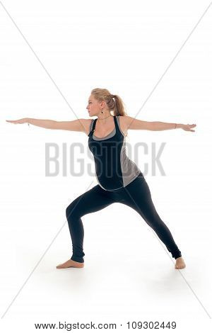 Pregnant woman doing sport exercises in yoga style