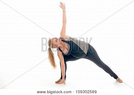 Pregnant woman doing sport exercises in yoga style