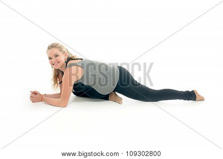 Pregnant woman doing sport exercises in yoga style