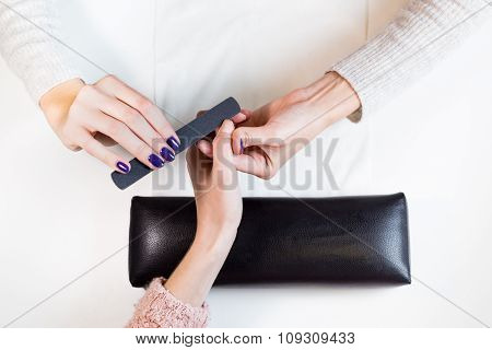 Step of manicure process nail file thumb