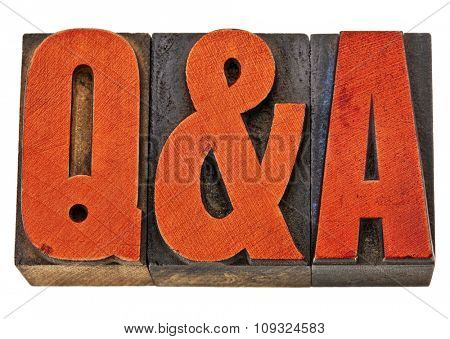 Q&A - questions and answers acronym - isolated text in vintage letterpress wood type stained by red ink