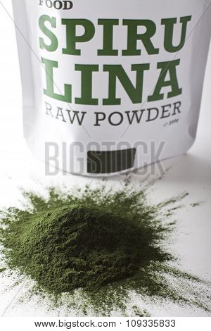 Spirulina raw powder on white background - heap.