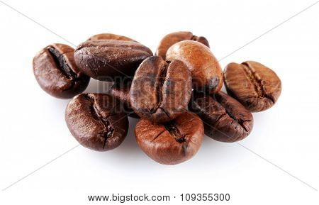 Brown coffee beans isolated on white