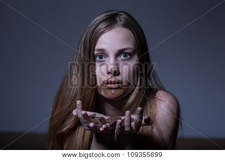 Bulimic Girl Eating Chocolate
