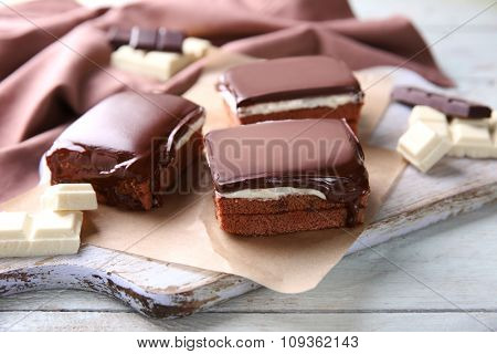 Delicious chocolate brownies on wooden background