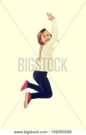 Little pretty girl jumping with joy