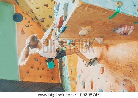 Girl Practicing In Climbing Gym