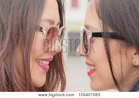 best friends trendy girls look at each other