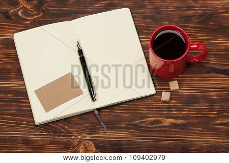 Blank Open Notepad. Cup Of Coffee. Wooden Background