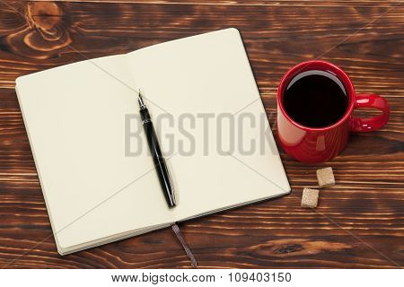 Blank Open Notepad. Cup Of Coffee. Wooden Background