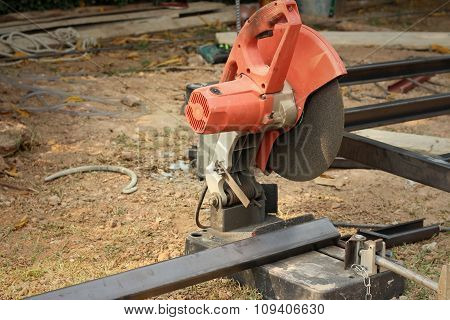 Mechanic Cutting A Steel At The Park