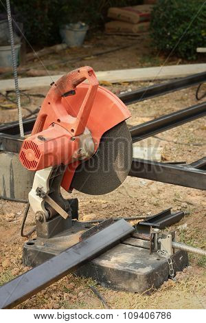 Mechanic Cutting A Steel At The Park
