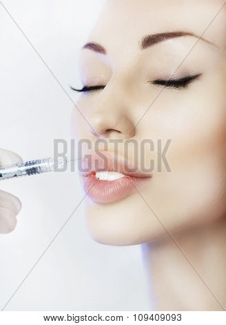 Woman Geting An Injection In Her Lips In Beauty Salon